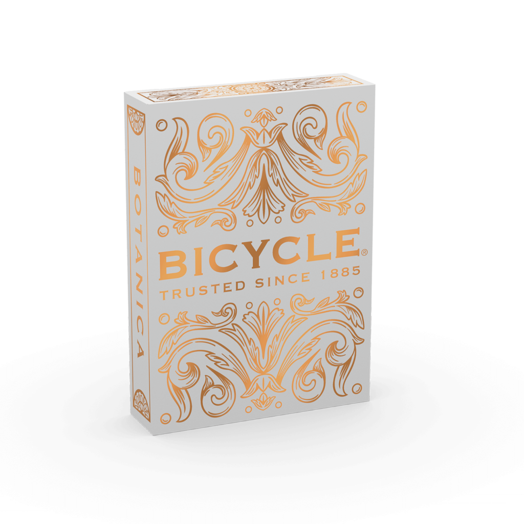 Eine Bicycle Creatives Botanica Kartenschachtel steht mit sichtbarer Vorderseite vor einem weißem Hintergrund.